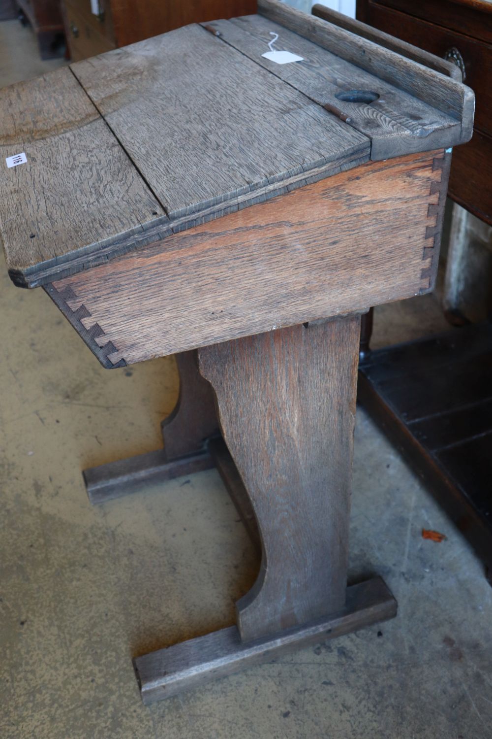 An early 20th century oak school desk, width 56cm